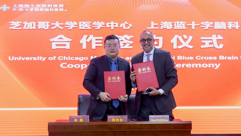 Zhu Min, general manager of Shanghai Blue Cross Brain Hospital (left), with Shyam Prabhakaran, MD, MS, Chair of Neurology at UChicago Medicine