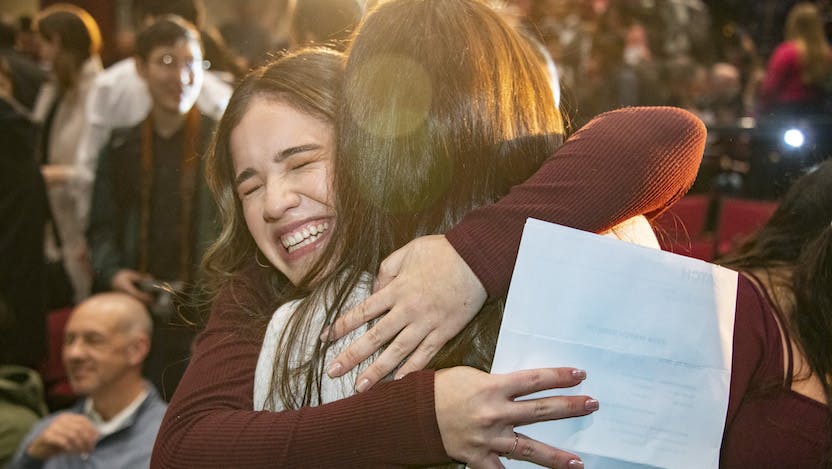 Maria Paz gets a celebratory hug after learning which residency program she matched with during Match Day 2024 on Friday, March 15 at the University of Chicago Pritzker School of Medicine