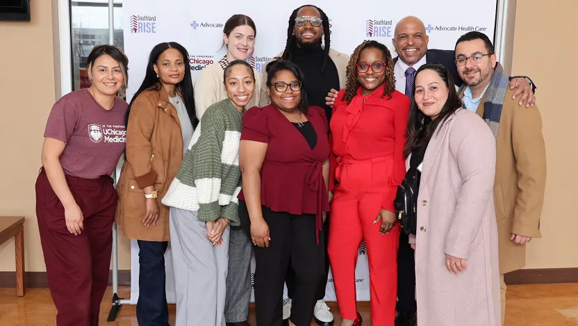 Staff from UChicago Medicine's Violence Recovery Program (VRP) stand alongside Michael Tafolla and Sara Calzada (right and second from right) of the nonprofit Claretian Associates. VRP representatives are, from left to right: Edith Gonzalez, DeQuesha Hopkins, Carla Sandoval, Jade Curless, Simone Gunn, Kenny White, Christine Goggins and Franklin Cosey-Gay.