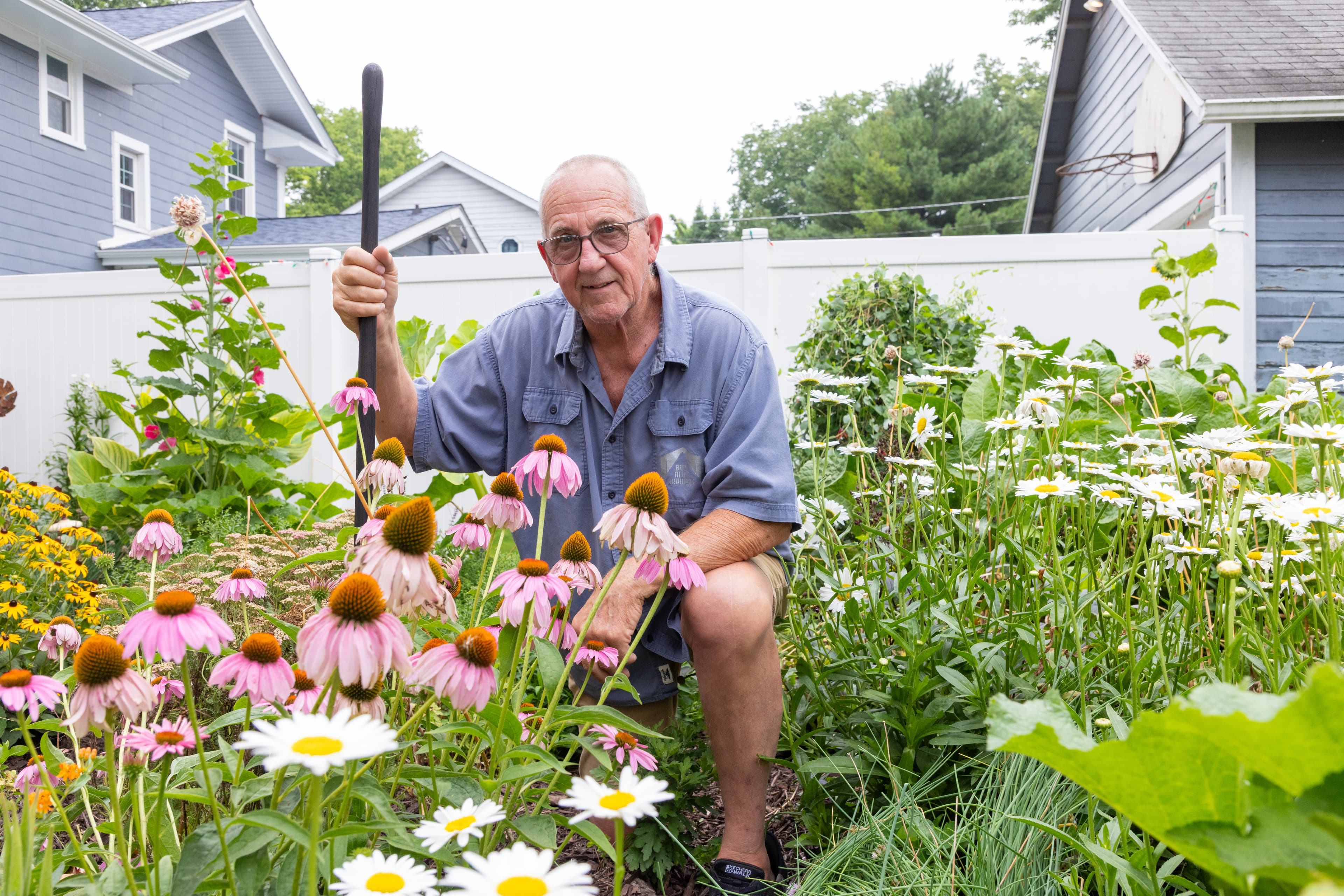 Spinal surgeon patient Steven poses while tending to his garden. Photos taken by Jordan Porter-Woodruff on 7/20/26