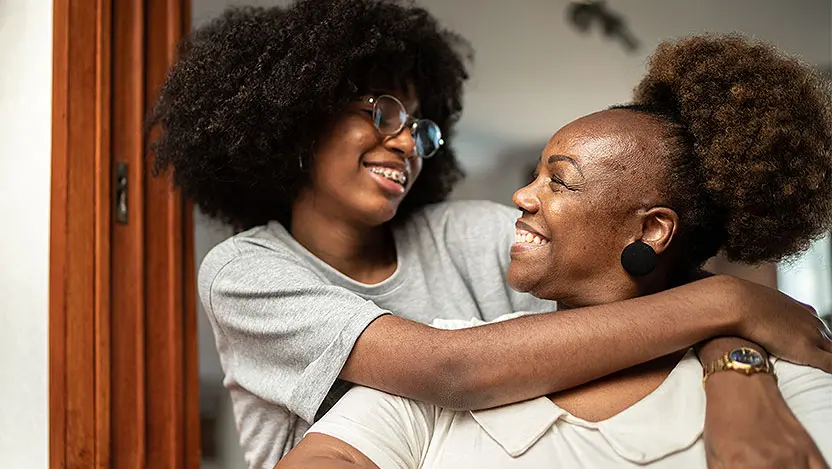 Teen hugs mom