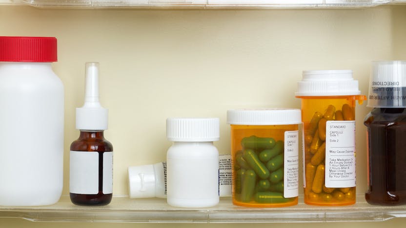 Containers of medicine in a medicine cabinet