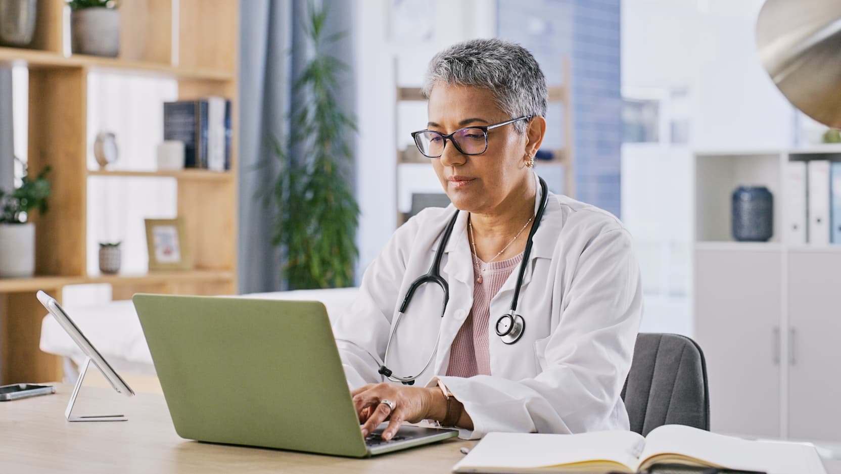 female physician on laptop