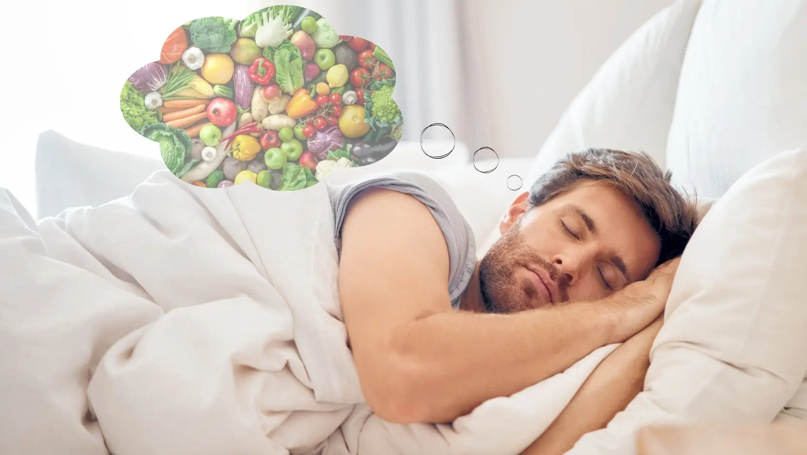 A man sleeps in a bed. A thought bubble above his head is filled with colorful fruits and vegetables.