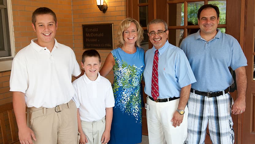 The Kedra family posing with Dr. Issam Awad.