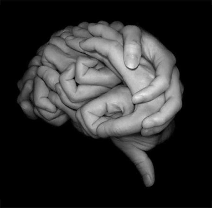 Hands shaped in the form of a brain
