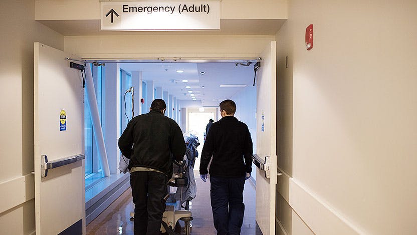 Team wheels trauma patient into adult emergency department at UChicago Medicine