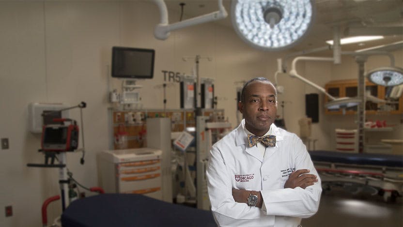 Portrait of trauma surgeon Selwyn Rogers Jr., MD, PhD, in the OR