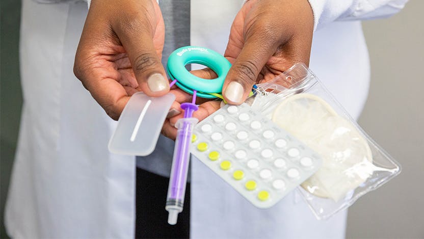 Image of doctor holding contraceptives