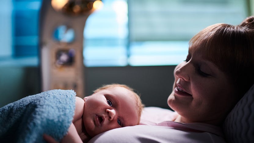 New mom Kristen Schwanz cradles newborn son Josh Biros at the Family Birth Center