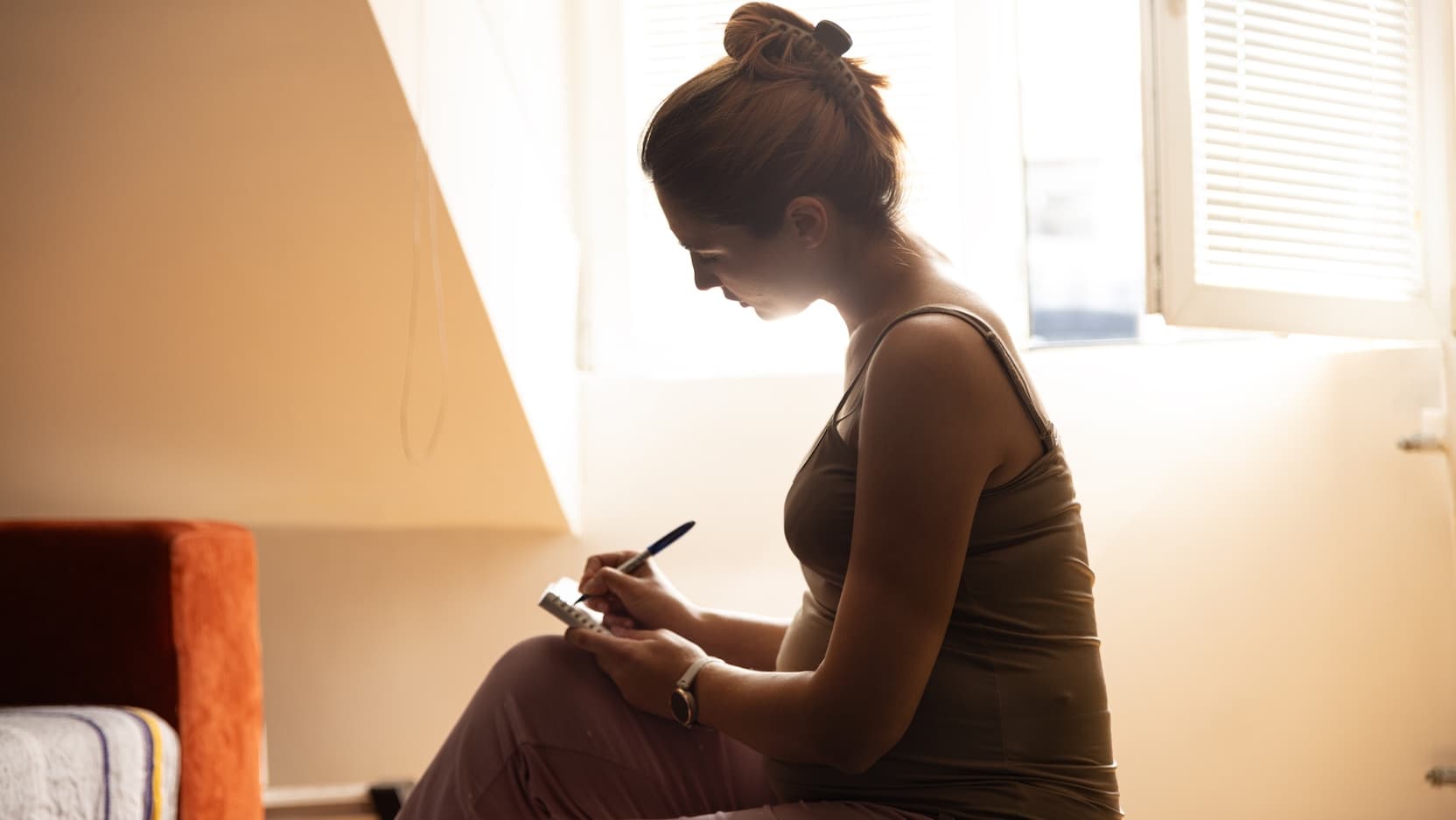 pregnant woman writing
