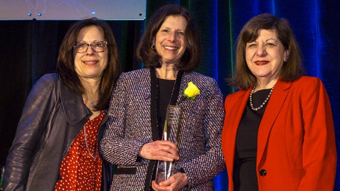 Susan Cohn, MD, center, accepting Joseph Burchenal Memorial Award at 2019 AACR