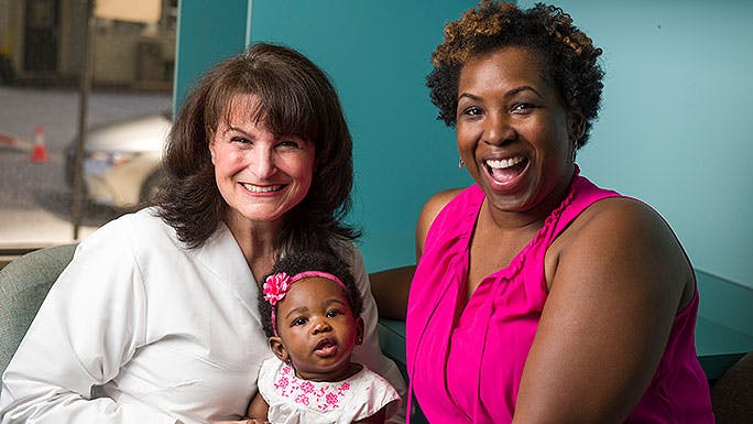 Dr. Shari Snow with Neangela Dixon and her daughter, Ryleigh