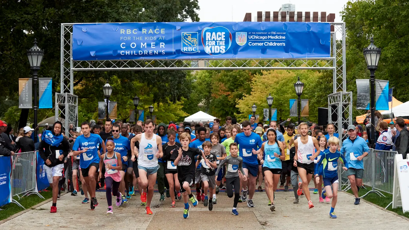 children running under RBC Race banner
