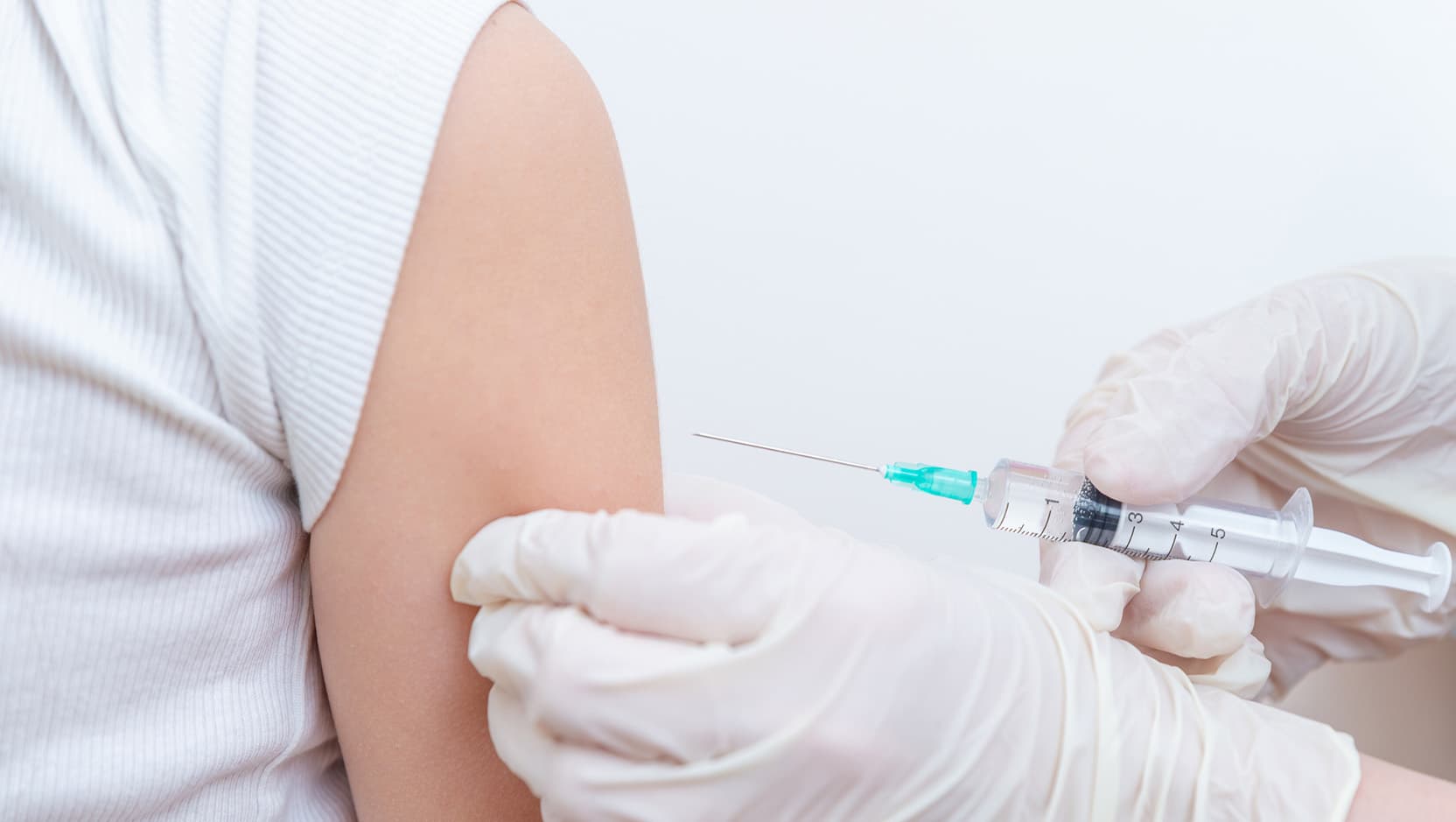 doctor injecting vaccine