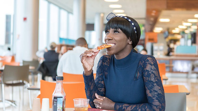 Achalasia patient, Dorian Brantley, enjoying pizza for the first time after surgery