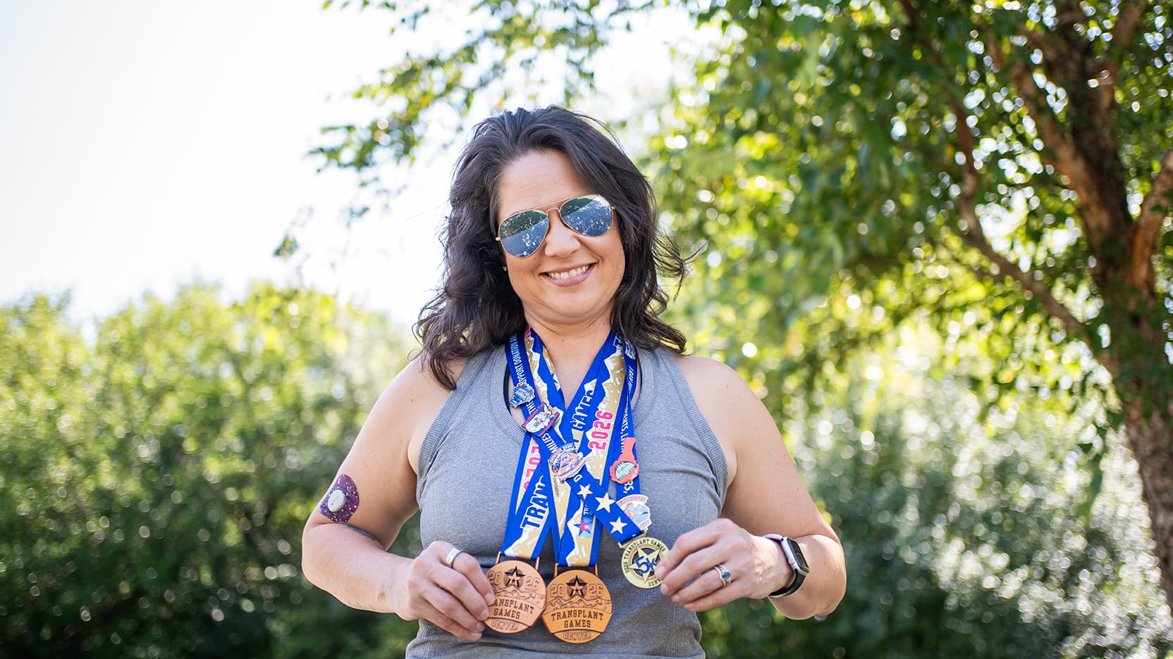 Elizabeth Sullivan transplant holding medals