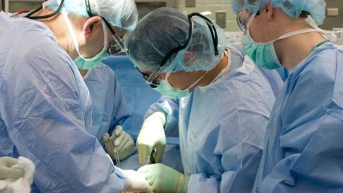 Heart and vascular surgeons operate on an aortic dissection patient