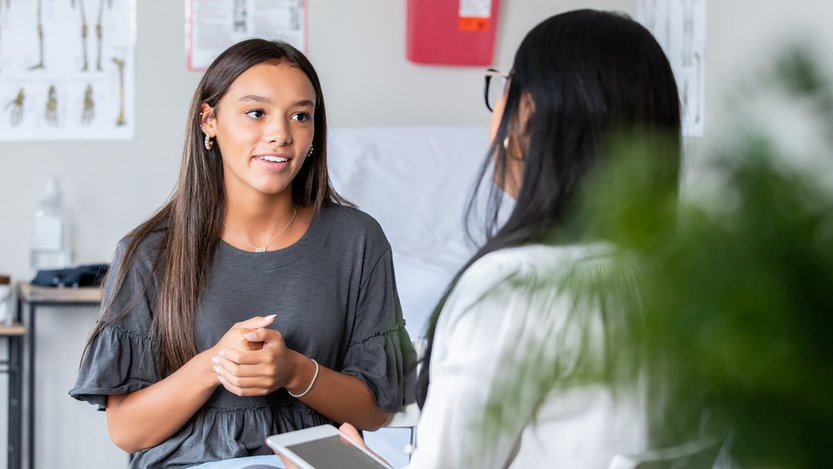 teen girl talking to doctor