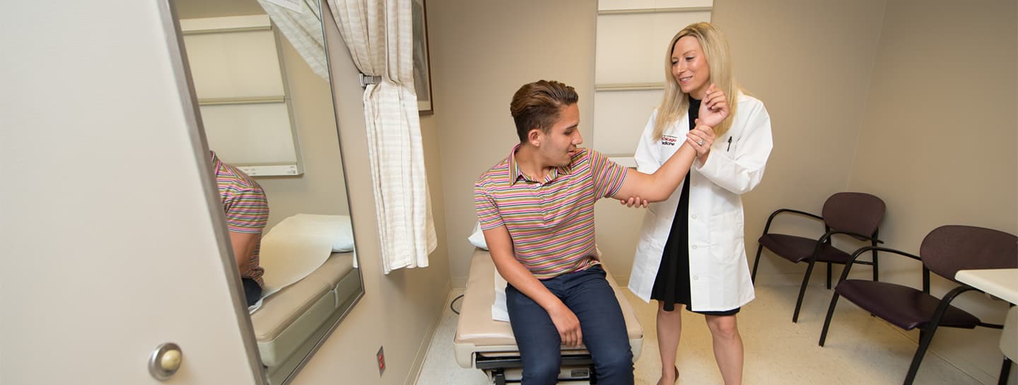 Dr. Conti Mica with patient