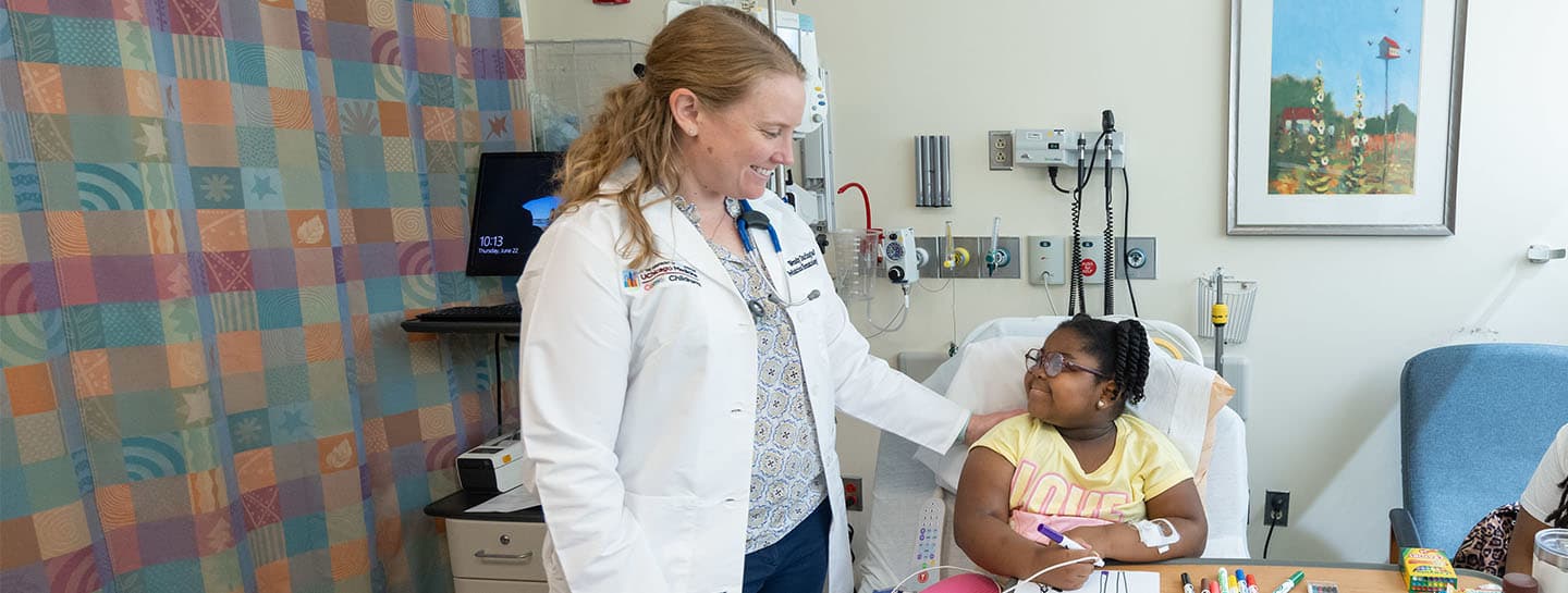 Image of Dr. Darlington working with pediatric patient