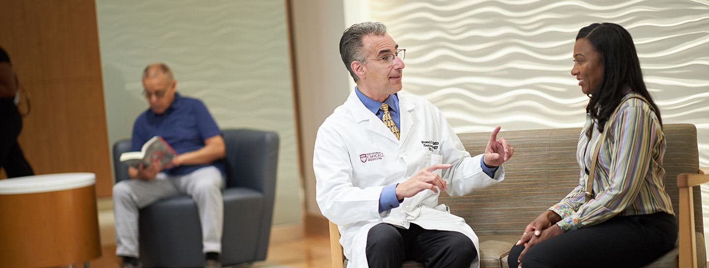 Russell Cohen, MD, with a patient in Orland Park