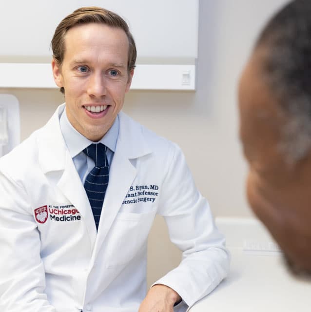Darren Bryan, MD, in clinic with patient