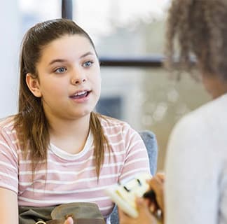 Image of pediatric patient talking to provider