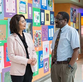 Gastroenterologists Ritu Verma, MD, and Timothy A. S. Sentongo, MD