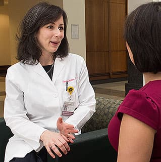 Dr. Stacy Tessler Lindau speaking with a patient