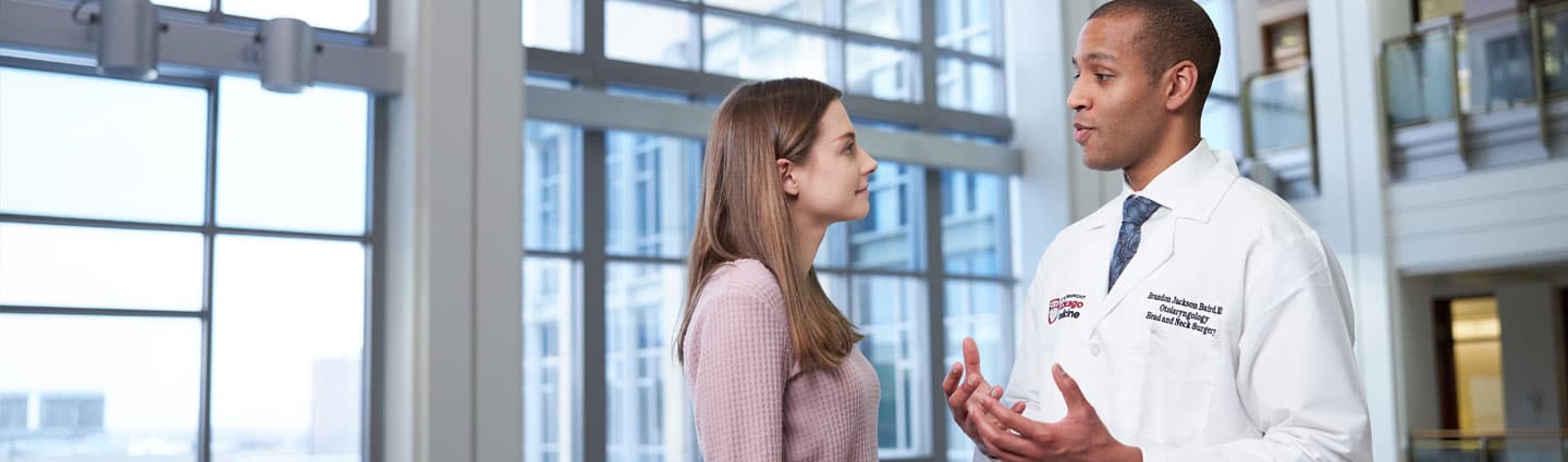 Laryngeal surgeon Brandon Baird, MD, with a patient in the DCAM