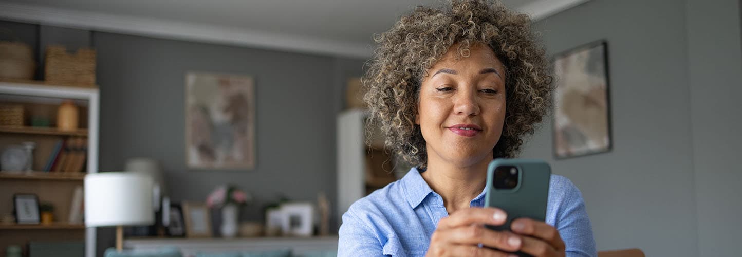 A woman looking at her phone