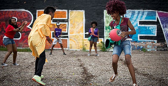 Children playing at a South Side block party event
