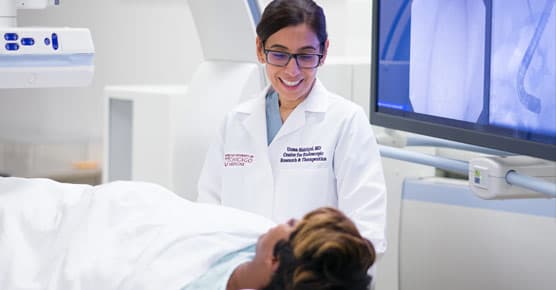 Uzma Siddiqui, MD, in interventional endoscopy lab with patient