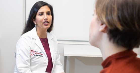 Shivika Trivedi-Kapadia, MD, in clinic with a patient