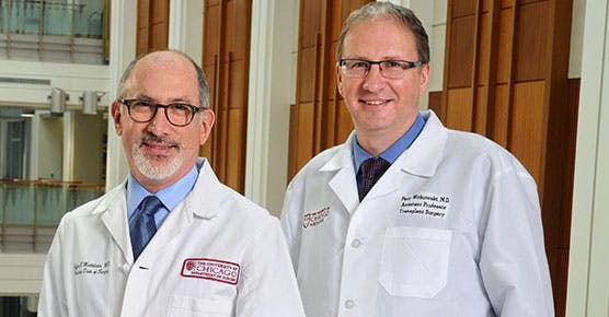 Photo of members of the Pancreas Center Team, Jeffrey Matthews, MD, Chair of the Department of Surgery, and Piotr Wikowski, MD, PhdD, Assistant Professor of Surgery and the Director of Pancreatic and Islet Transplant Program