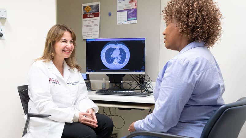 Marina Chiara Garassino, MD, with patient in clinic