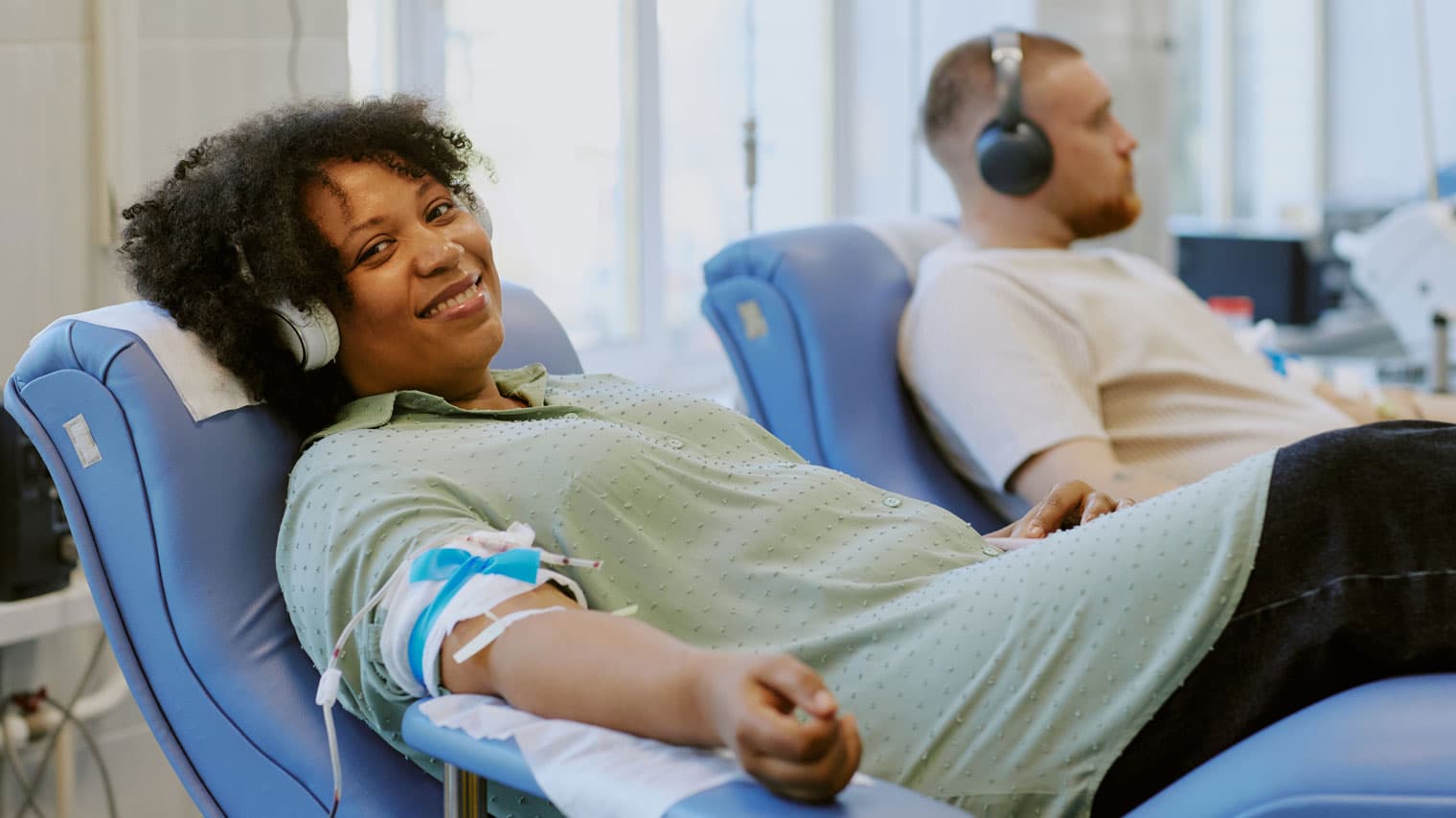 Woman and man donating blood