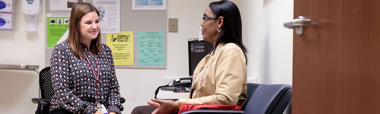 A member of our kidney care team meeting with a patient
