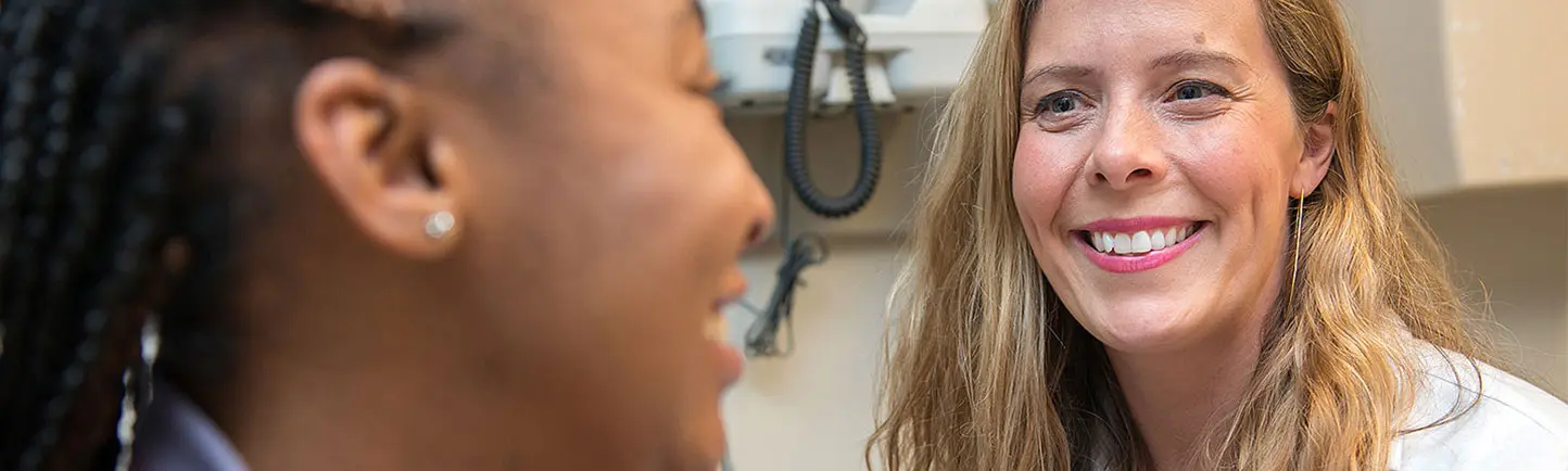 Gynecologist Carrie Smith, MD, talking with a patient