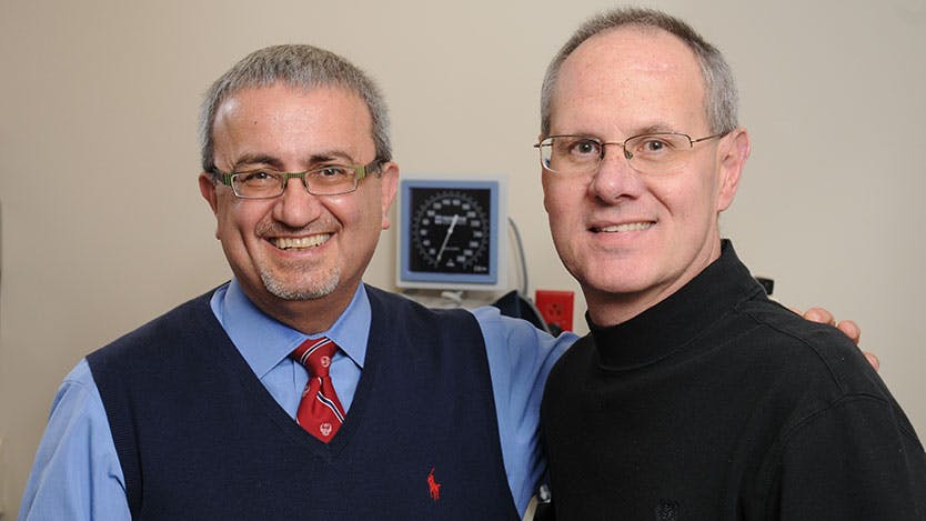 Issam Awad, MD, (left) director of neurovascular surgery with patient Joseph Pagone