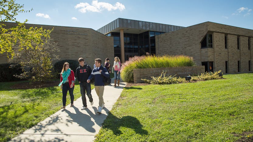 Students walking on campus path