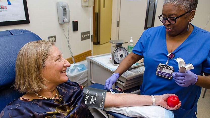 Woman gets prepped for blood donation