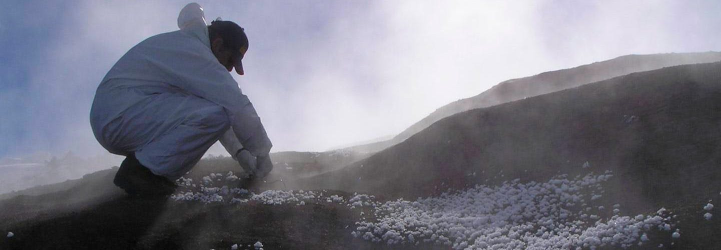 Researcher sampling the southernmost geothermal soils on the planet at the summit of Mt Erebus, Ross Island, Antarctica (photo credit: S. Craig Cary, Univ. of Waikato, New Zealand)