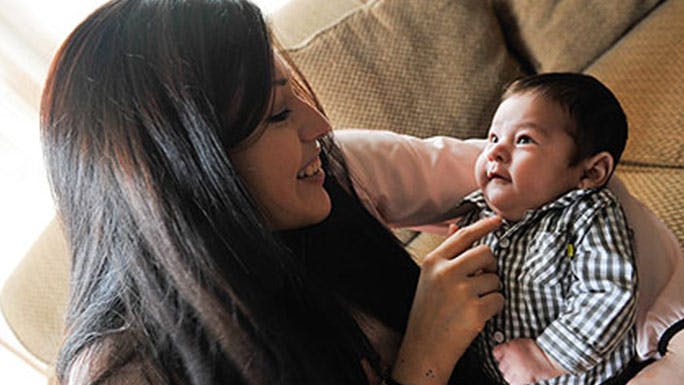 Sofia Espinoza cradles her newborn son John Carlos Guzman, who was born with a rare fetal neck mass