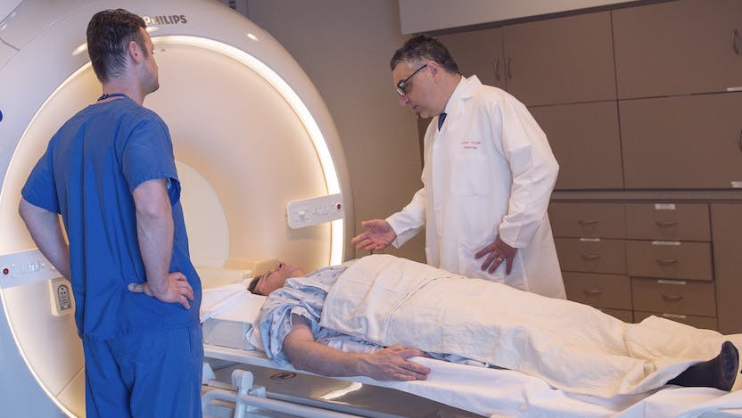 Aytekin Oto with a patient in the MRI machine